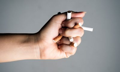 hand with cigarette sticks