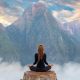 lady meditating facing mountains