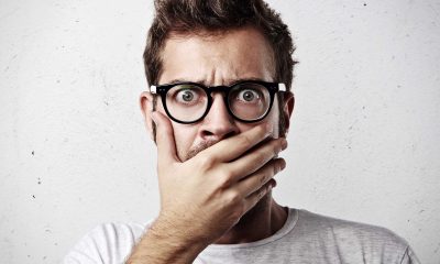 scared or shocked man with glasses
