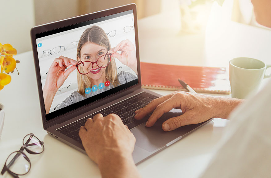 woman on laptop screen trying eyewear