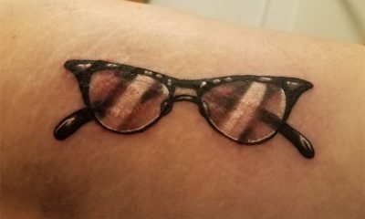 eyewear tattoo on arm