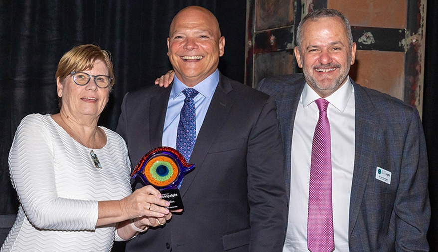 Dr. Susan Cooper, OGS Chair, Canada, and Dr. Juan Carlos Aragon, OGS Chair, USA, present CooperVision President Jerry Warner with the evening's highest honor.