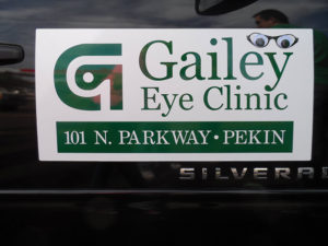 Branded signage adorns one of the company vehicles used by staff to travel between locations.